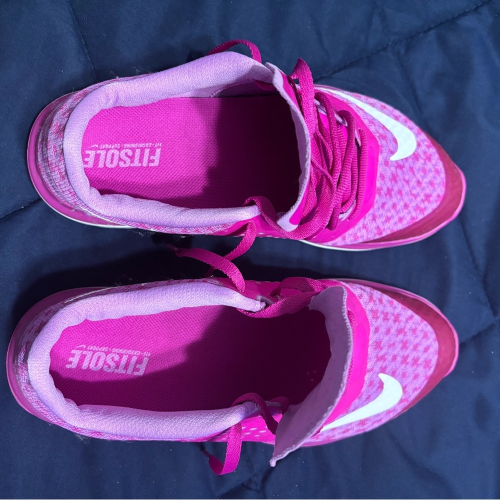 Nike Vibrant Purple and Pink Athletic Shoes from the FITSOLE line.